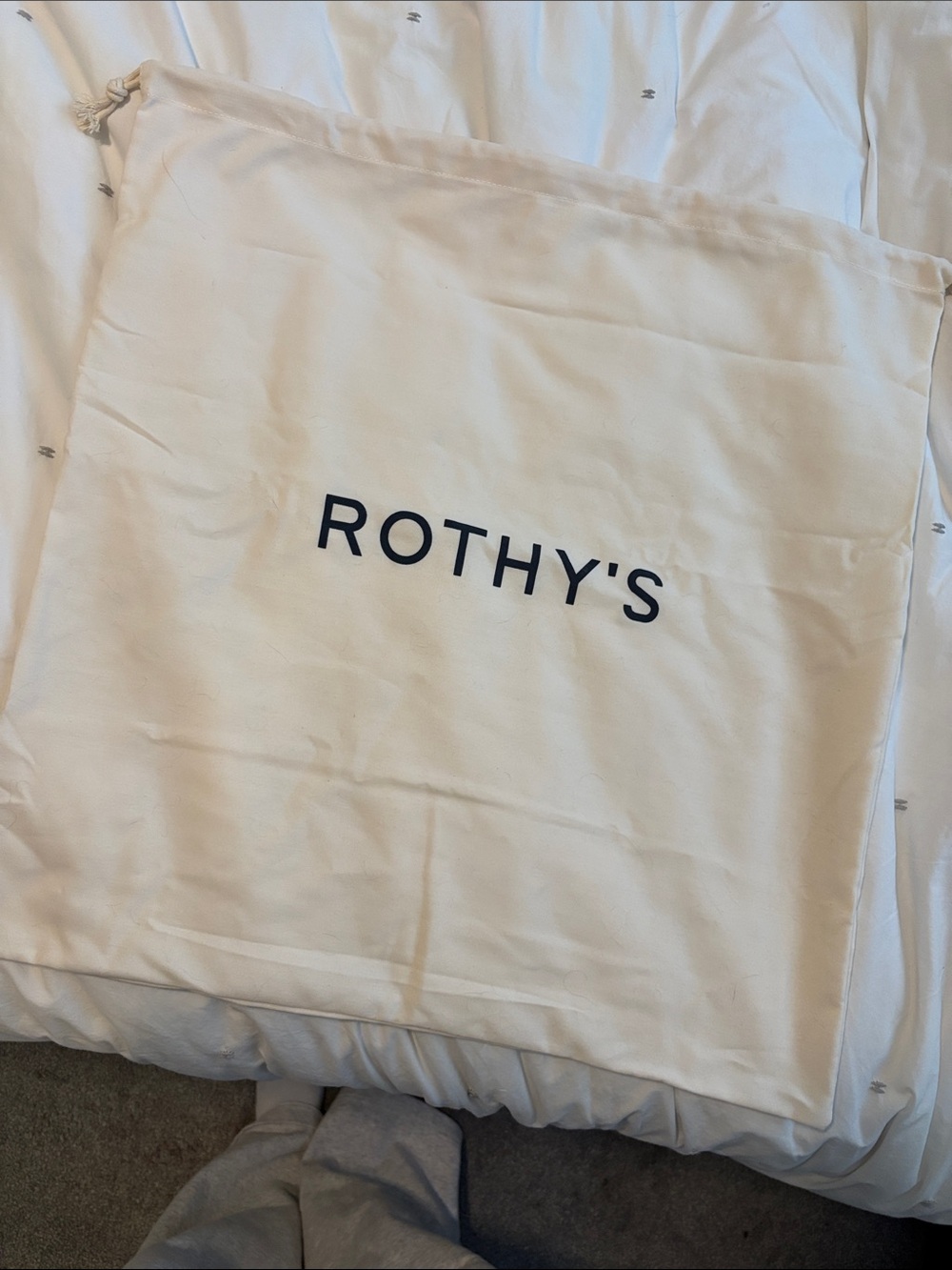 Rothy's Off-White Canvas Drawstring Bag with Black Logo